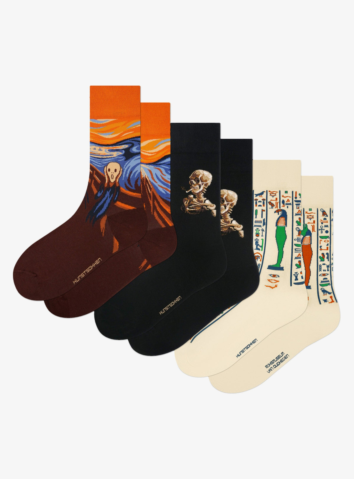 Gruselige Meisterwerke 3er-Pack von Kunstsokken: Der Schrei, Schädel eines Skeletts mit brennender Zigarette und Söhne des Horus Socken nebeneinander